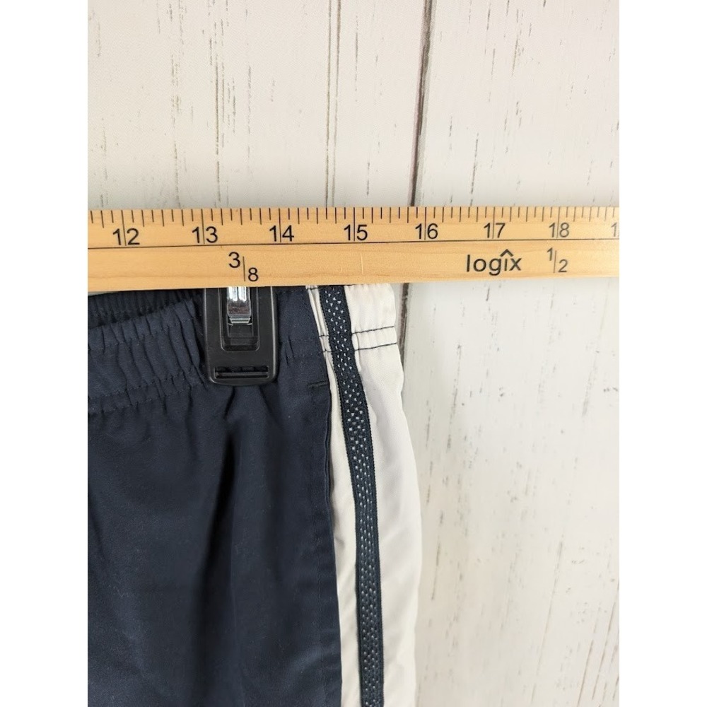 Under Armour Size Medium Dark Blue White Stripe Active Windbreaker Crop‎ Pants - Picture 4 of 7